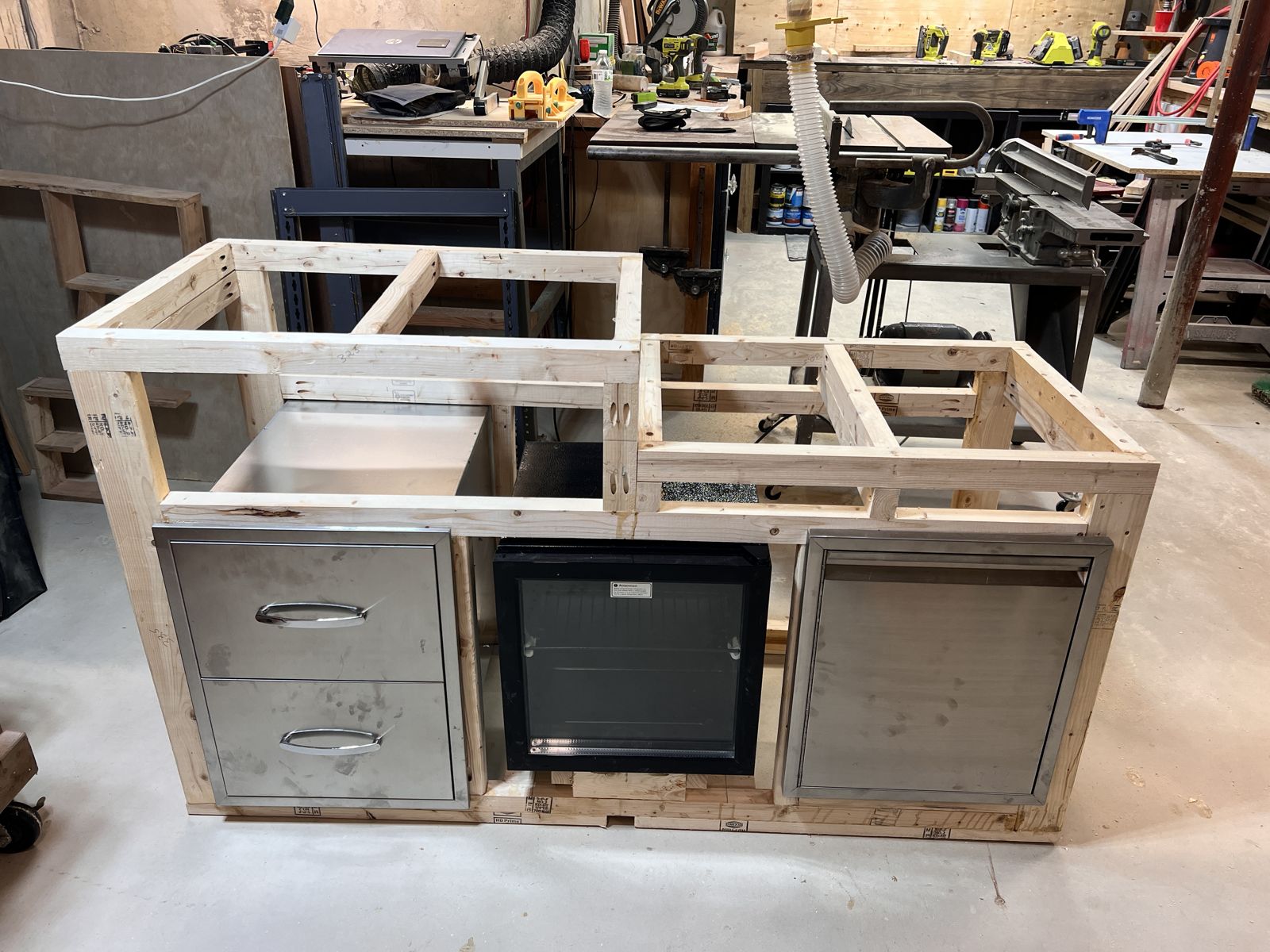 Drawers, fridge and door framed in
