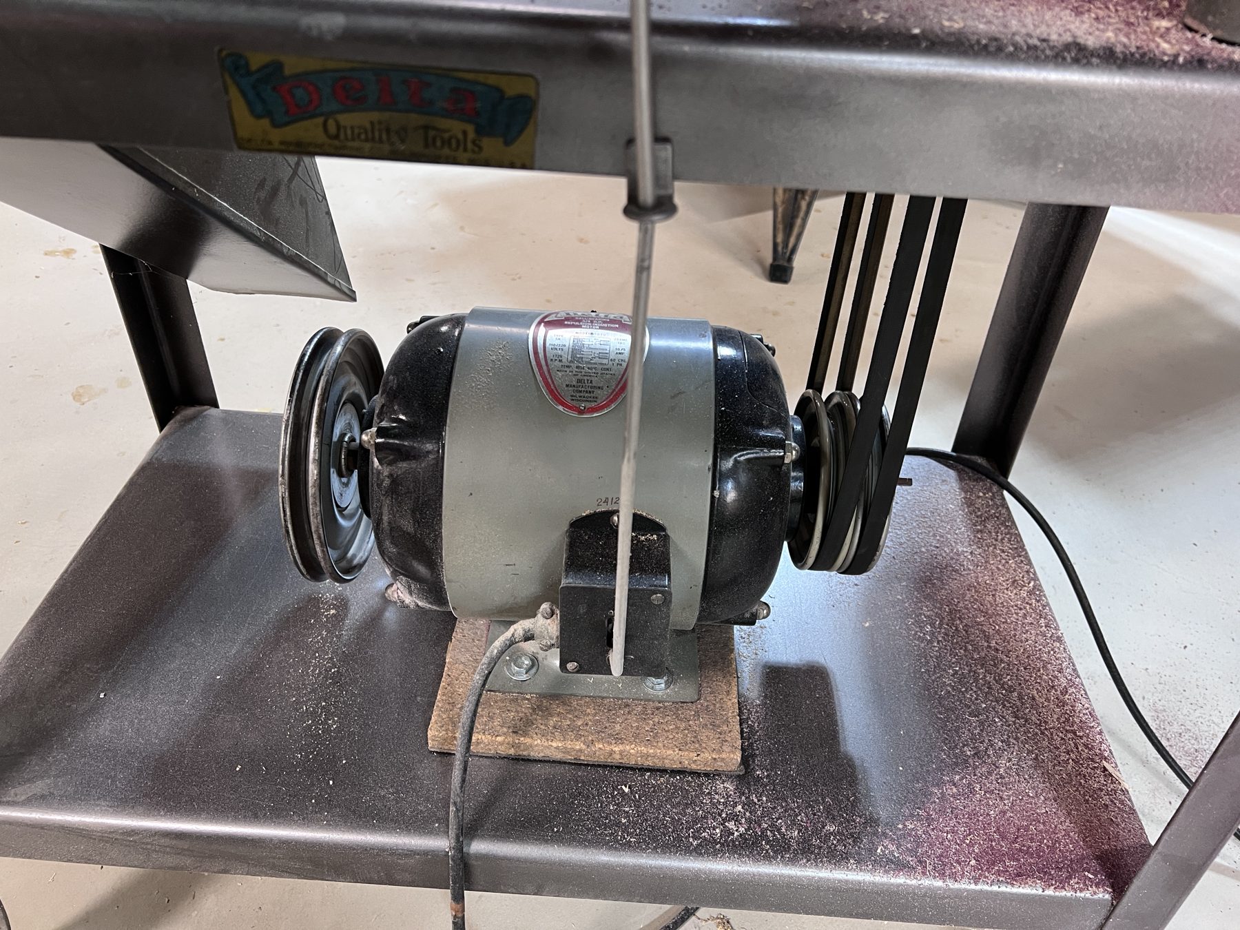 The original Delta repulsion-induction motor with its nameplate