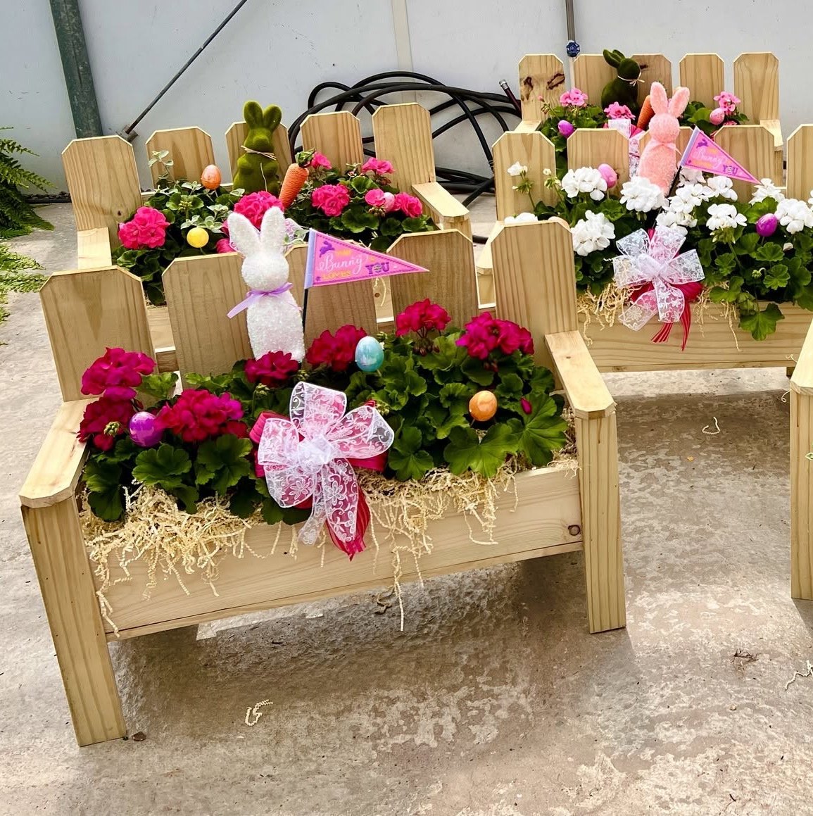 Handmade wooden bench planters filled with spring flowers